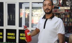 Yıkatmaya getirilen araçtan çıkan dumanları fark eden çalışanın hızlı müdahalesi aracı yanmaktan kurtardı